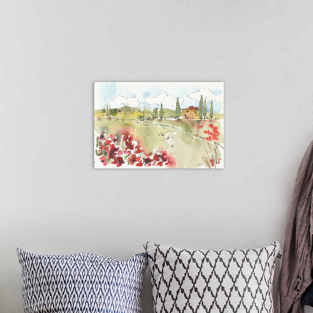 A bohemian room featuring Watercolor painting of a Tuscan landscape with red flowers in the foreground.