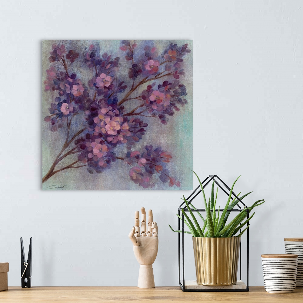A bohemian room featuring Painting of tree branch filled with small pastel colored flowers.