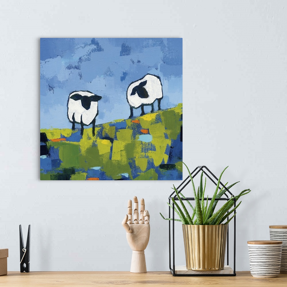A bohemian room featuring Cool toned square abstract painting of two sheep standing on a hill made out of short blue, green...
