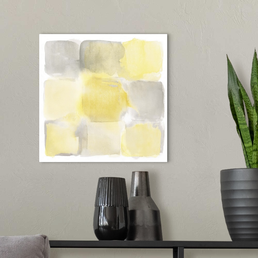 A modern room featuring Simple watercolor painting of yellow and gray square shapes.