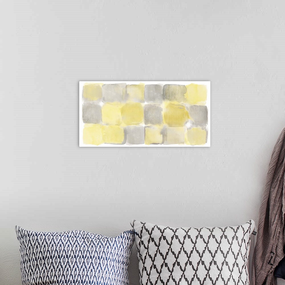 A bohemian room featuring Watercolor abstract painting of yellow and grey squares.