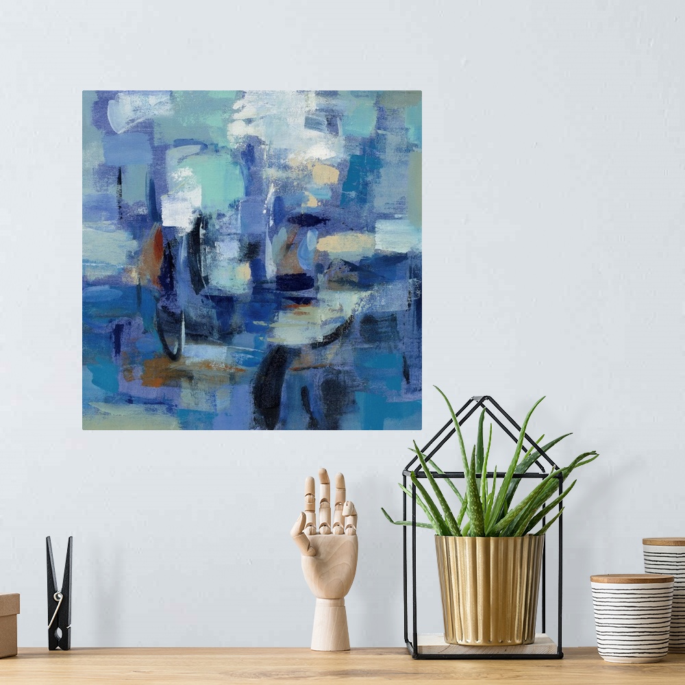A bohemian room featuring Contemporary abstract painting using a multitude of blue tones and bold textures.