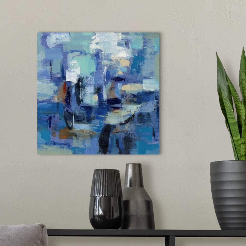 A modern room featuring Contemporary abstract painting using a multitude of blue tones and bold textures.