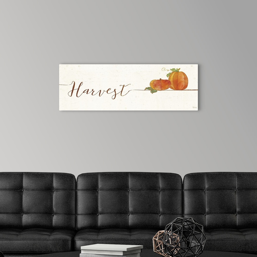 A modern room featuring Horizontal artwork of "Harvest" in handwritten text with a pair of pumpkins.