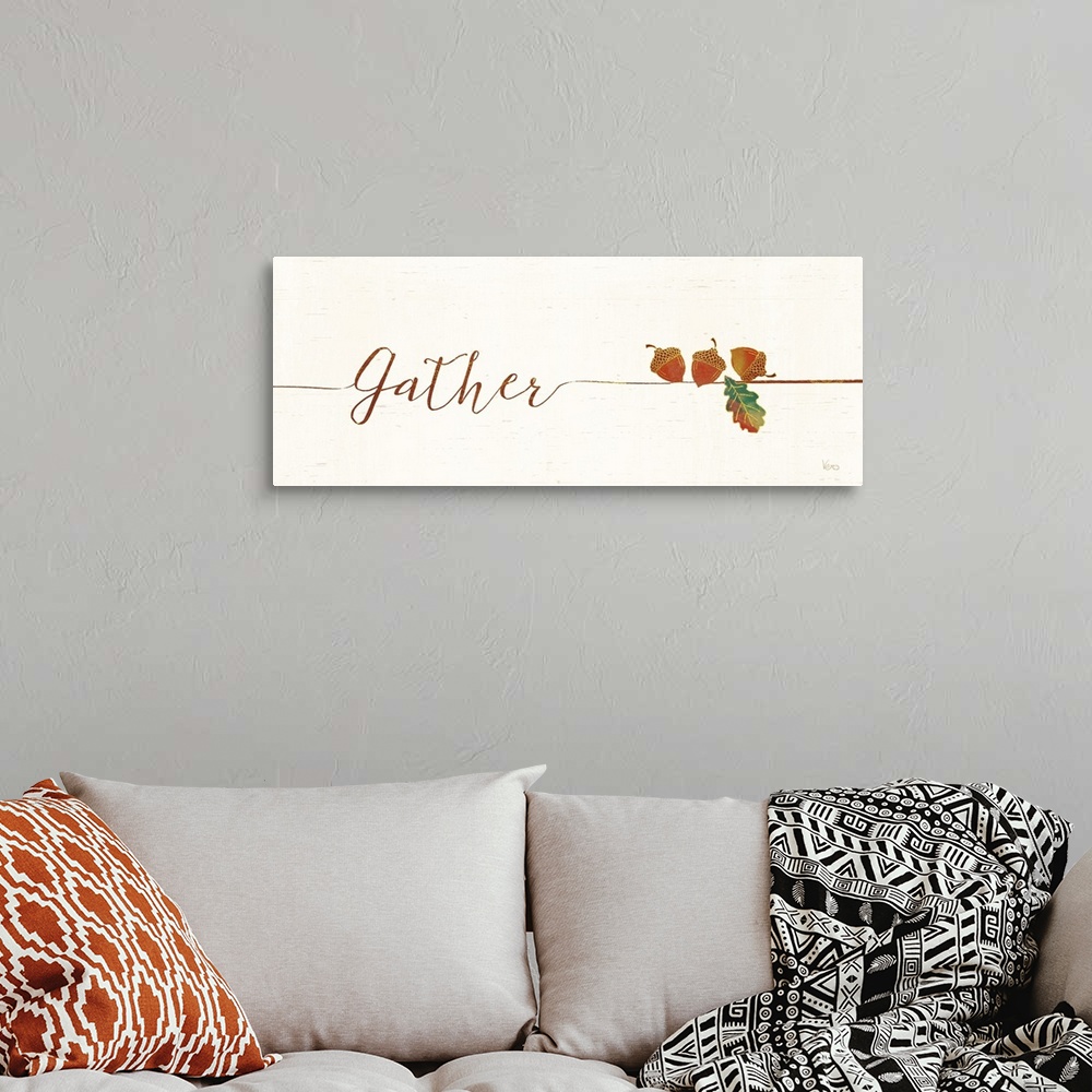 A bohemian room featuring Horizontal artwork of "Gather" in handwritten text with a a few acrons.