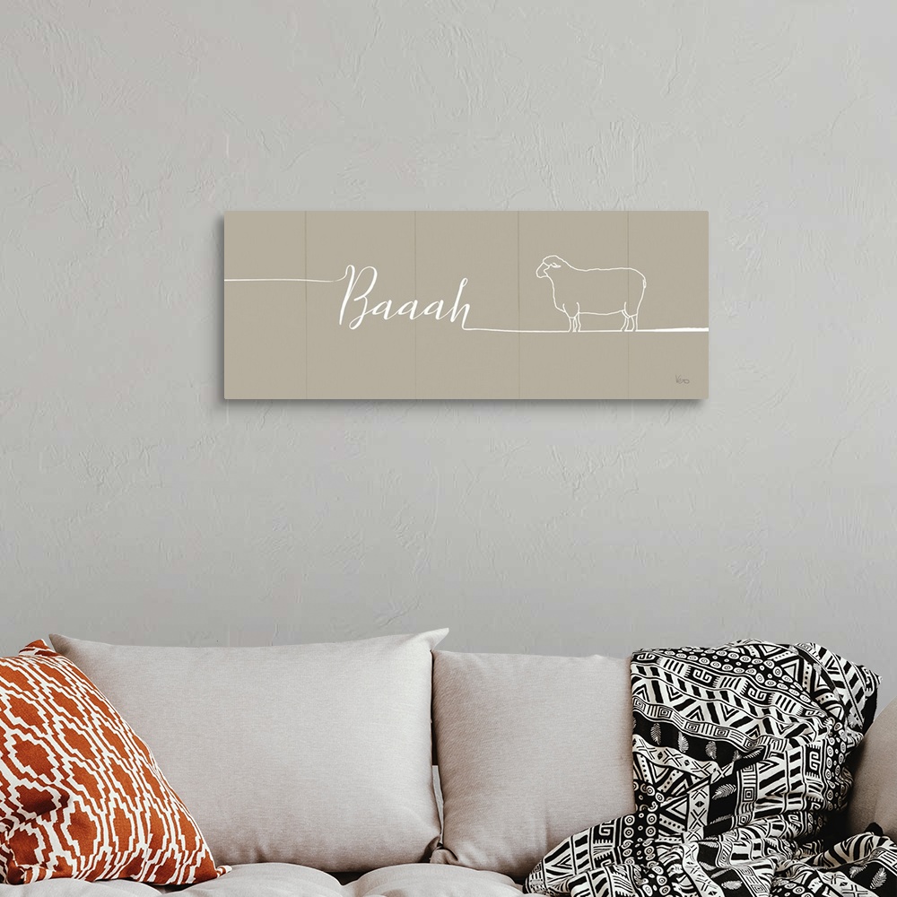 A bohemian room featuring "Baaah" with the outline of a sheep on a beige plank background.
