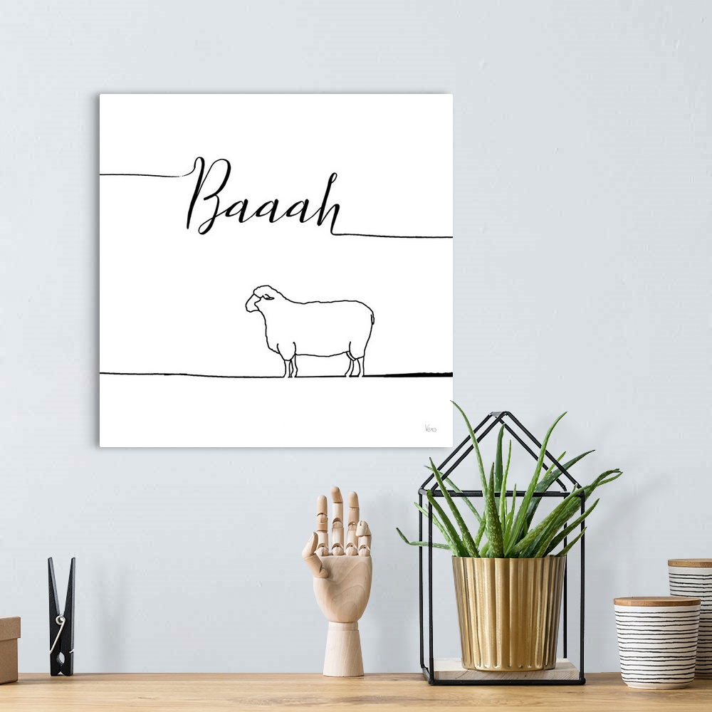 A bohemian room featuring A simple black and white design of a sheep with the text "Baaah".
