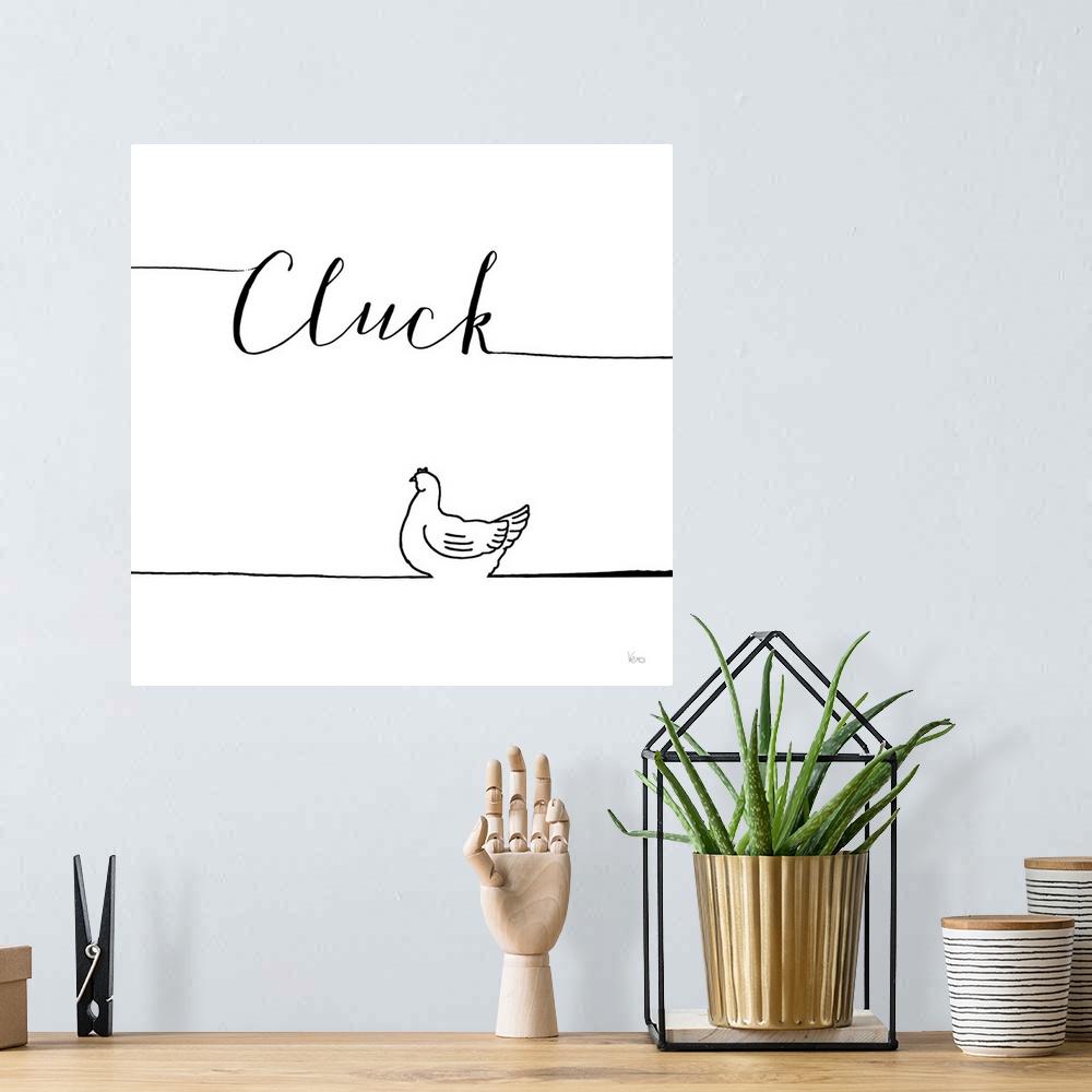 A bohemian room featuring A simple black and white design of a chicken with the text "Cluck".