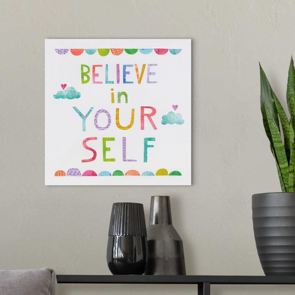 A modern room featuring Whimsy inspirational decor with the phrase "Believe In Yourself" written in different colors.