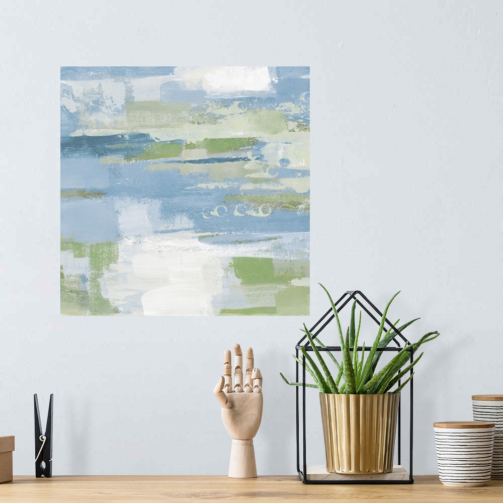 A bohemian room featuring A square abstract painting of horizontal brush strokes in textured tones of blue, green and white.