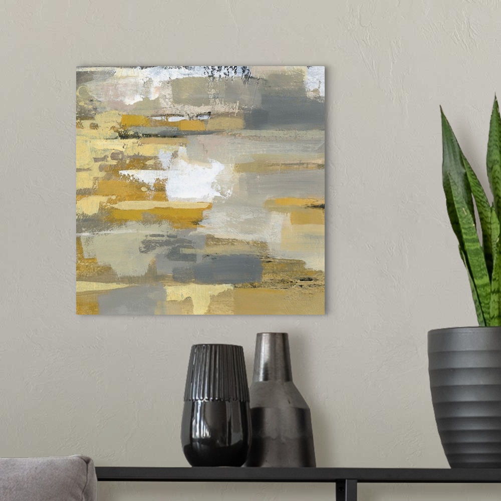 A modern room featuring Abstract contemporary artwork in yellow and grey tones.