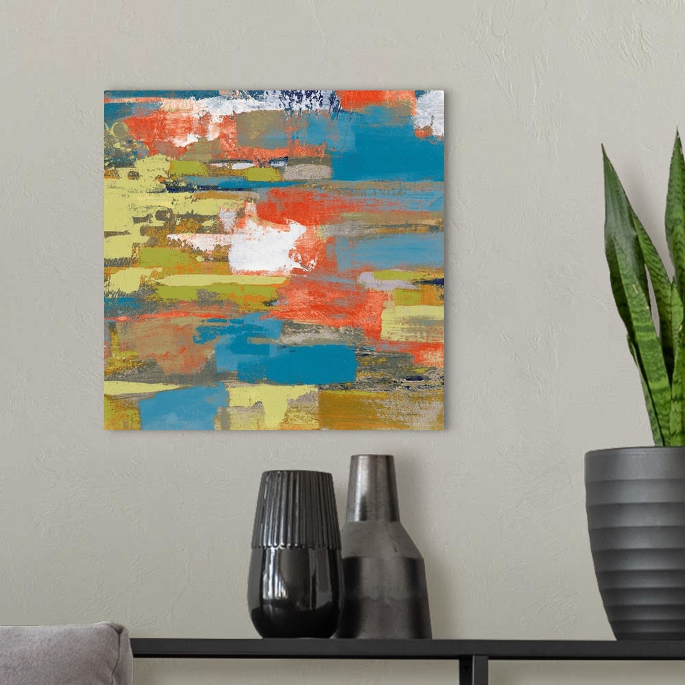 A modern room featuring Large abstract painting made with shades of green, blue, gray, orange, and white on a square canvas.