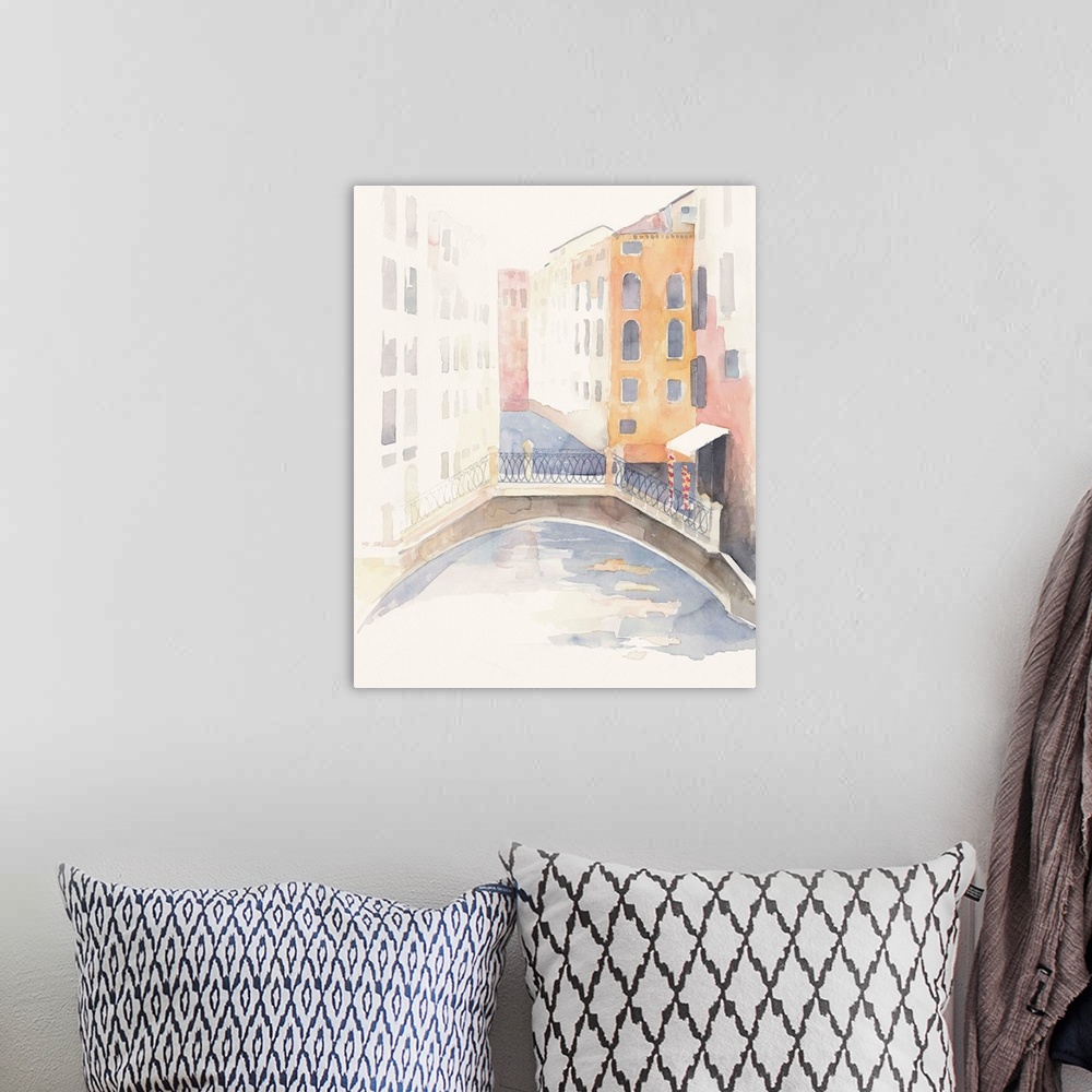 A bohemian room featuring Watercolor painting of a view of Venice looking down a canal way.