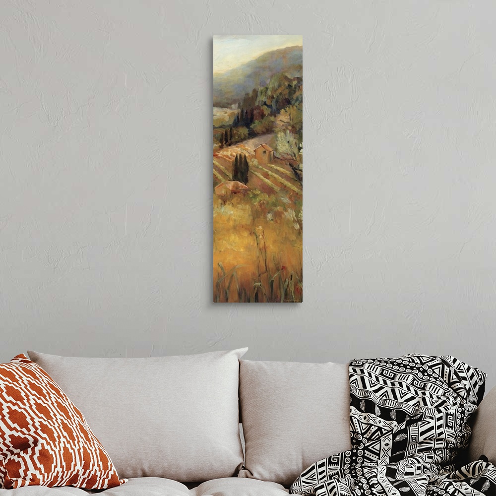 A bohemian room featuring Giant, vertical painting overlooking a golden vineyard, surrounded by trees and mountains in the ...