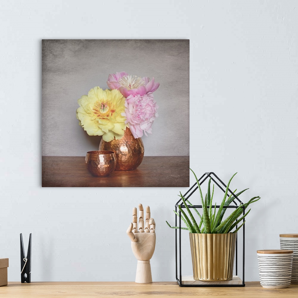 A bohemian room featuring Still life photograph of a copper vase full of pink and yellow peonies with a distress overlay.