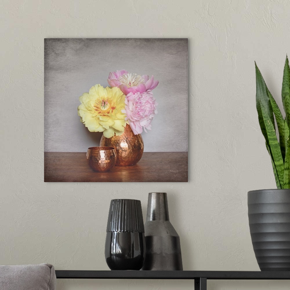 A modern room featuring Still life photograph of a copper vase full of pink and yellow peonies with a distress overlay.