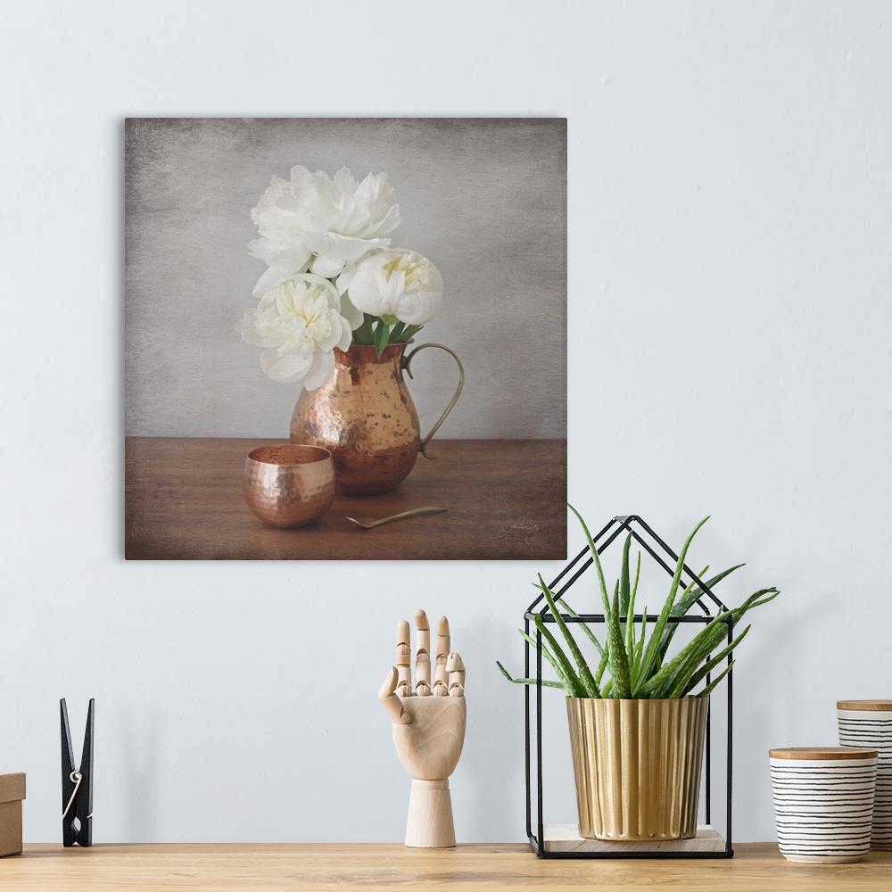 A bohemian room featuring Still life photograph of a copper vase full of white peonies with a distress overlay.