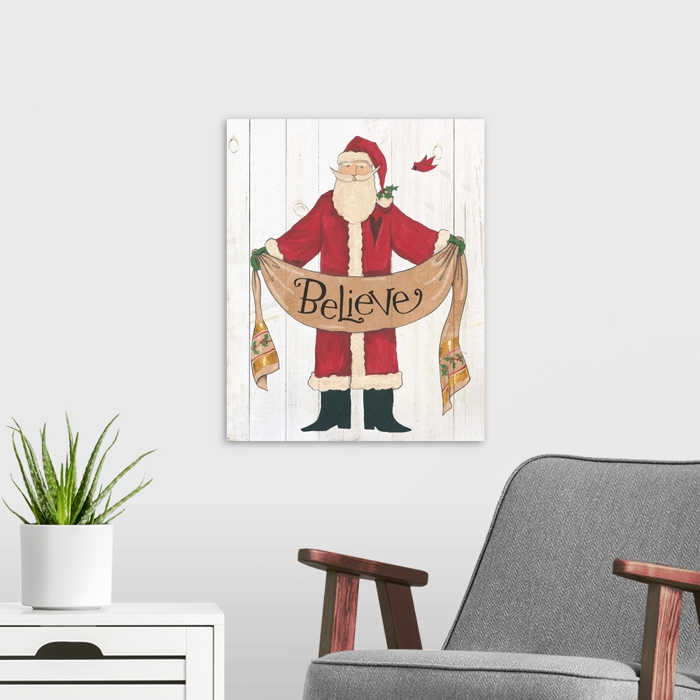 A modern room featuring Santa Claus holding a banner with "believe" on a white wood plank backdrop.