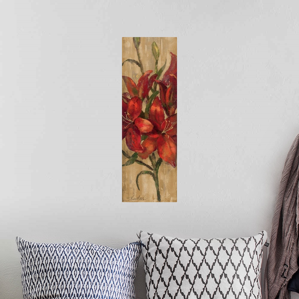 A bohemian room featuring A long vertical piece of artwork perfect for the home of large red lilies on a neutral colored ba...