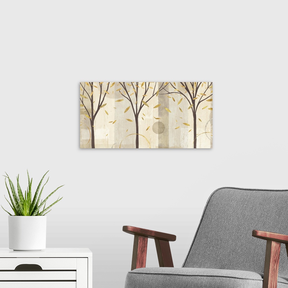 A modern room featuring Contemporary artwork of three trees with metallic gold leaves falling on a neutral patterned colo...
