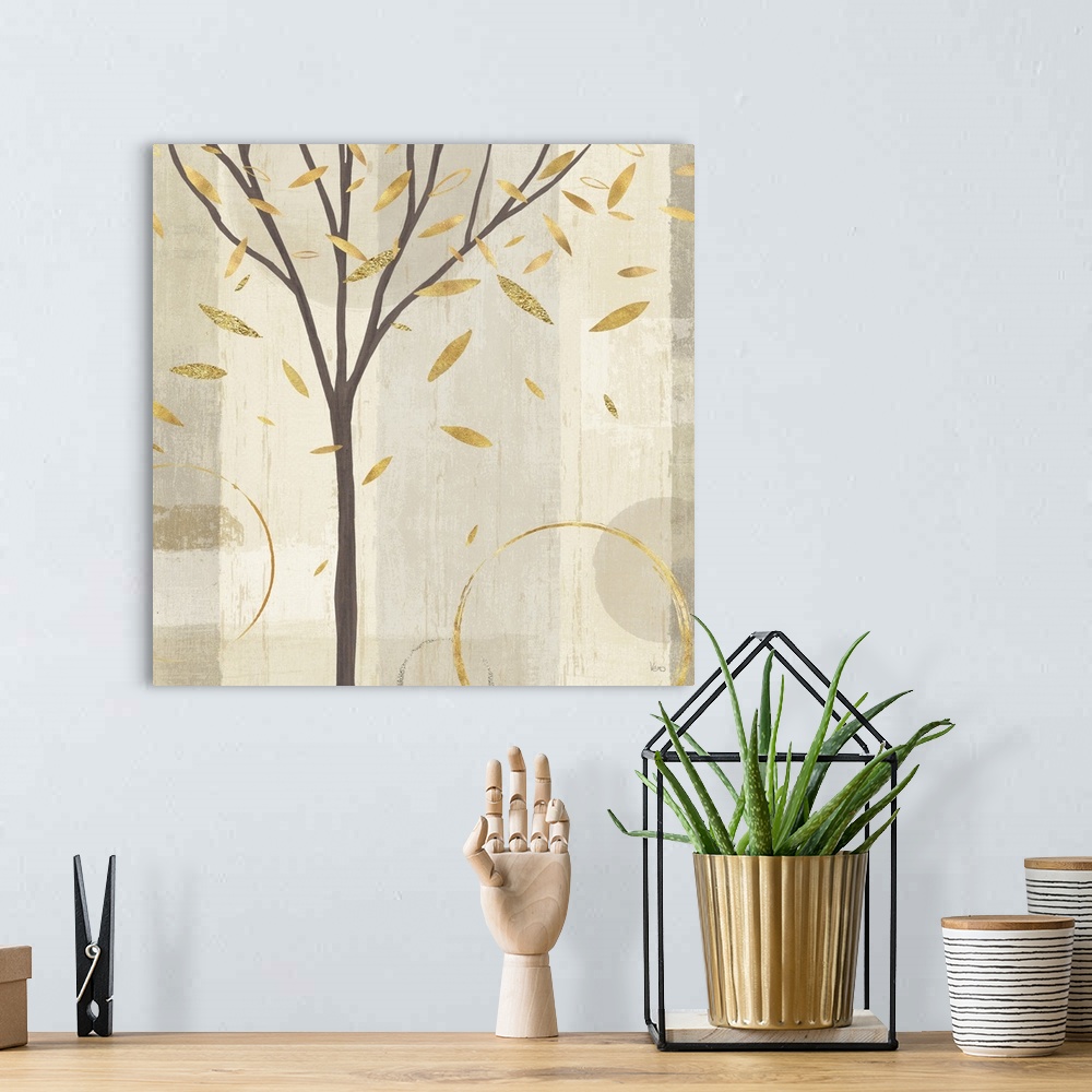 A bohemian room featuring Watercolor painting of a tree shedding metallic gold leaves on a background made with different s...