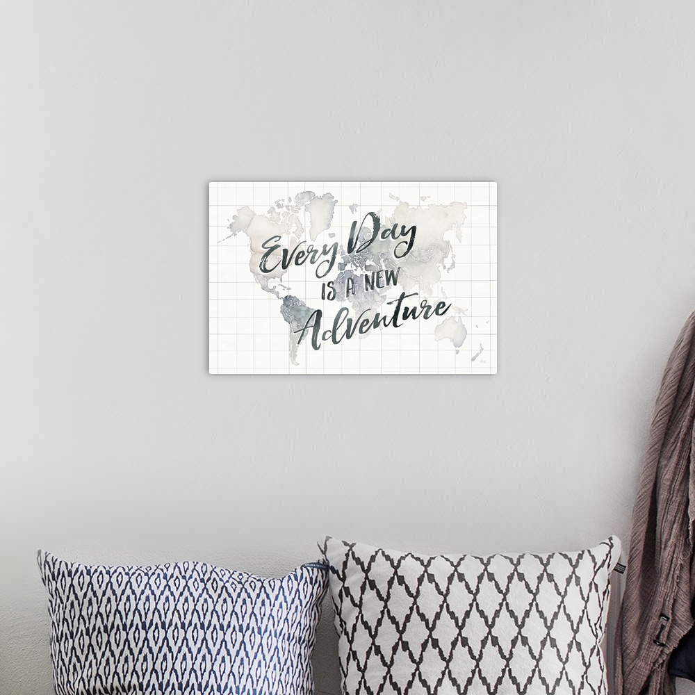 A bohemian room featuring "Every Day is a New Adventure" handwritten on top of a watercolor map of the world with grid lines.