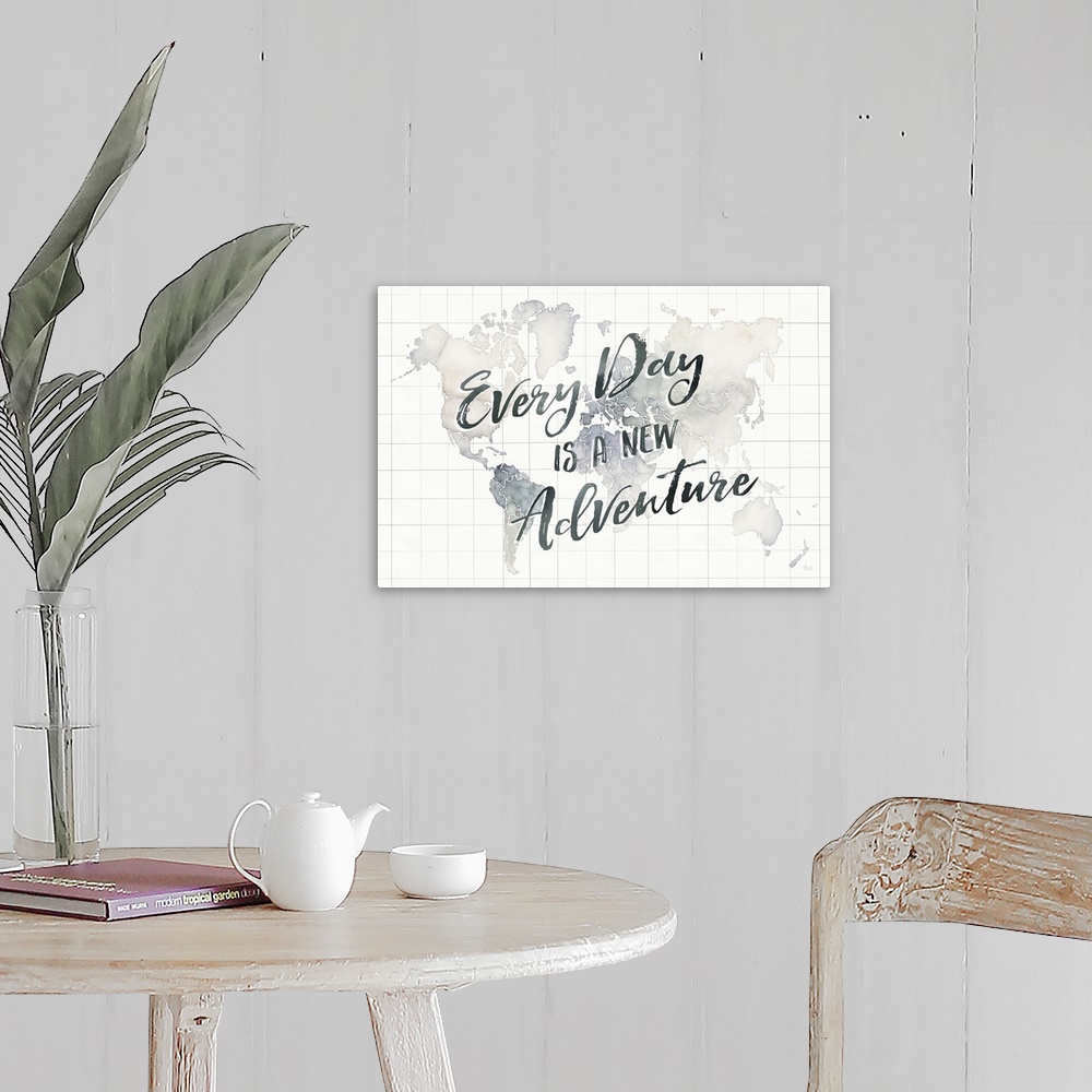 A farmhouse room featuring "Every Day is a New Adventure" handwritten on top of a watercolor map of the world with grid lines.
