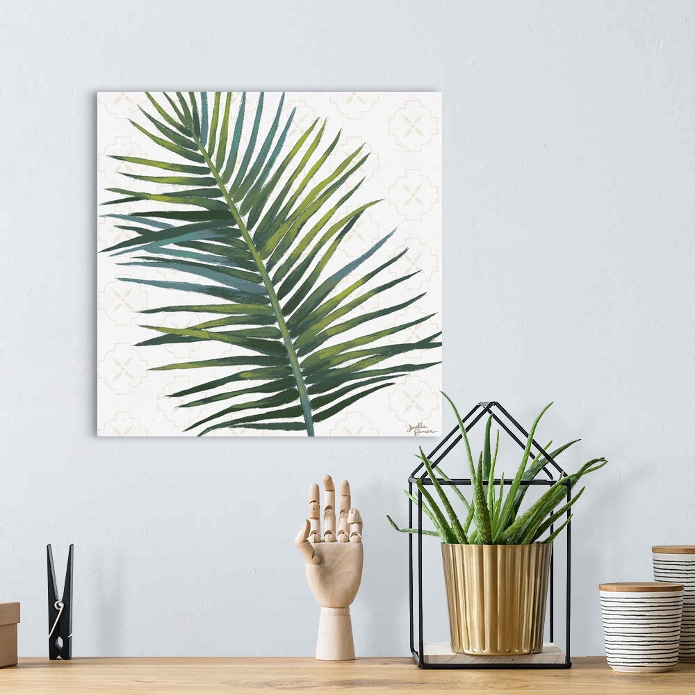 A bohemian room featuring Square art of a green palm leaf on a white background with a faint beige pattern.