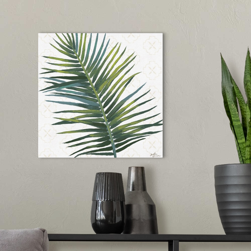 A modern room featuring Square art of a green palm leaf on a white background with a faint beige pattern.