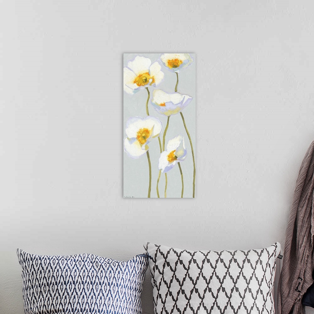 A bohemian room featuring Giant, vertical, floral painting of five white poppy flowers on thin, waving stems, extending upw...