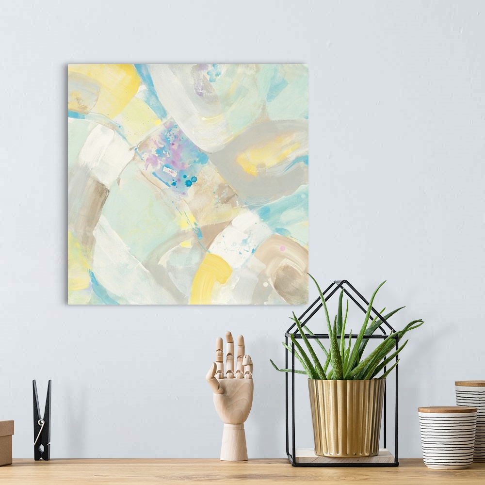 A bohemian room featuring Abstract artwork in pastel shades of yellow and blue.