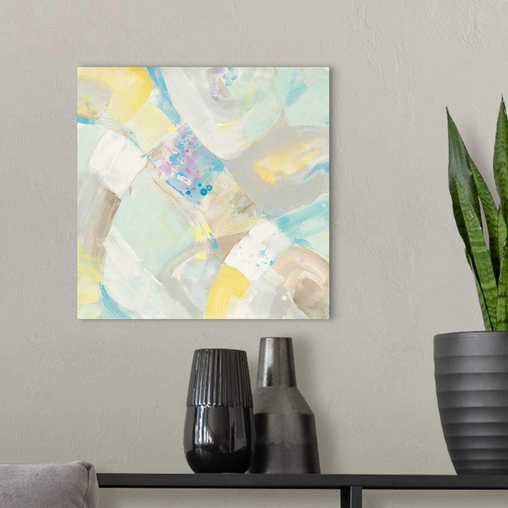 A modern room featuring Abstract artwork in pastel shades of yellow and blue.