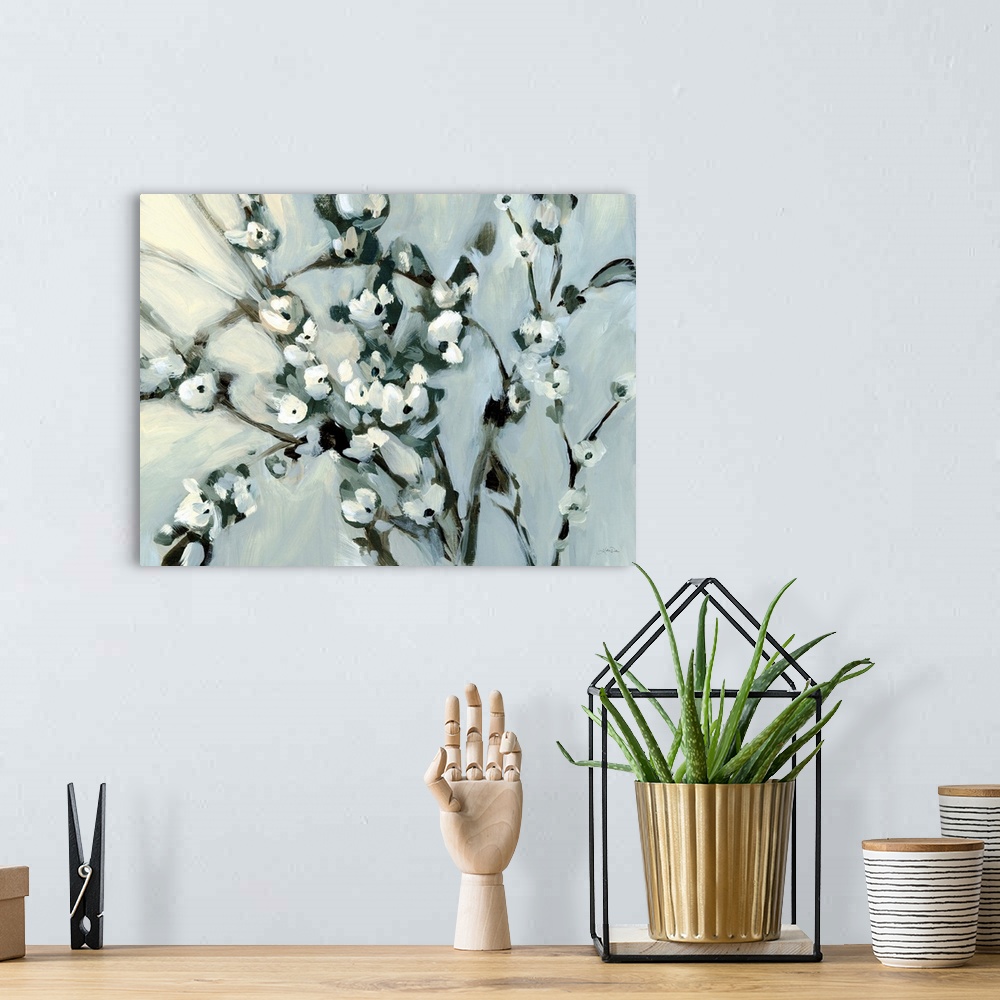 A bohemian room featuring A bold contemporary painting of branches of white flowers against a grey background