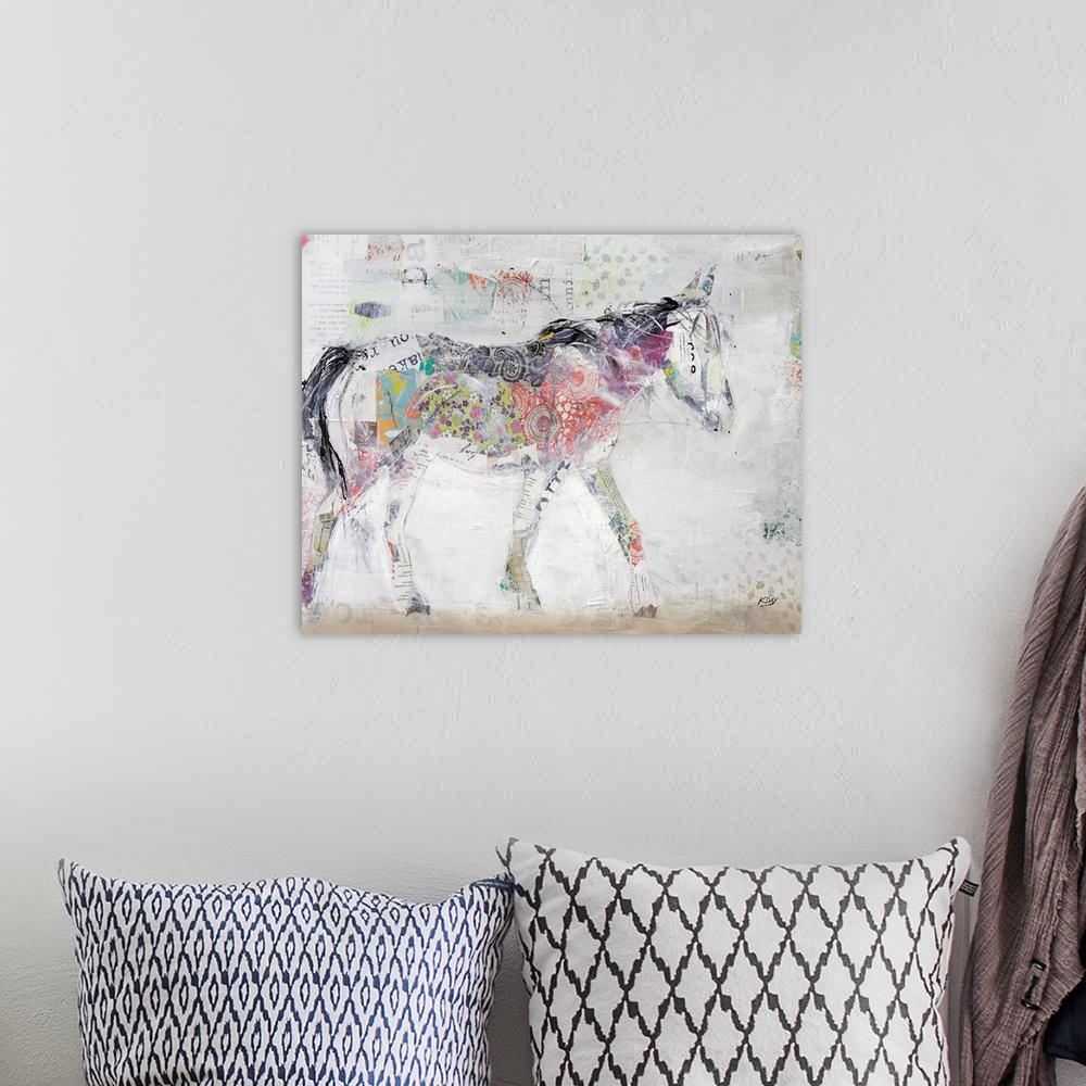 A bohemian room featuring Large abstract art of a wild horse created with mixed media.