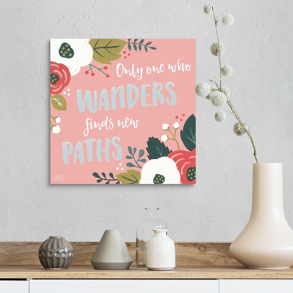 A farmhouse room featuring "Only One Who Wanders Finds New Paths" framed by flowers on a pink background.