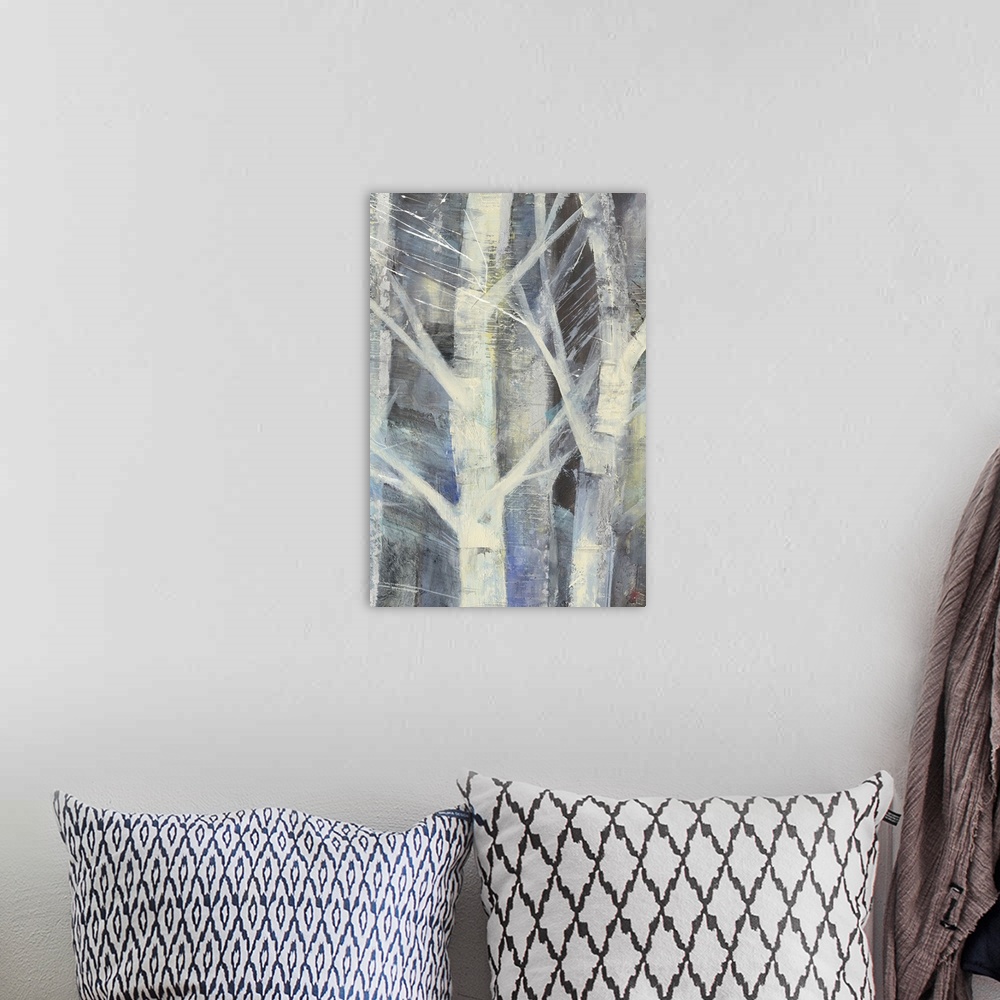 A bohemian room featuring Contemporary painting of white trees against a multi-toned blue background.