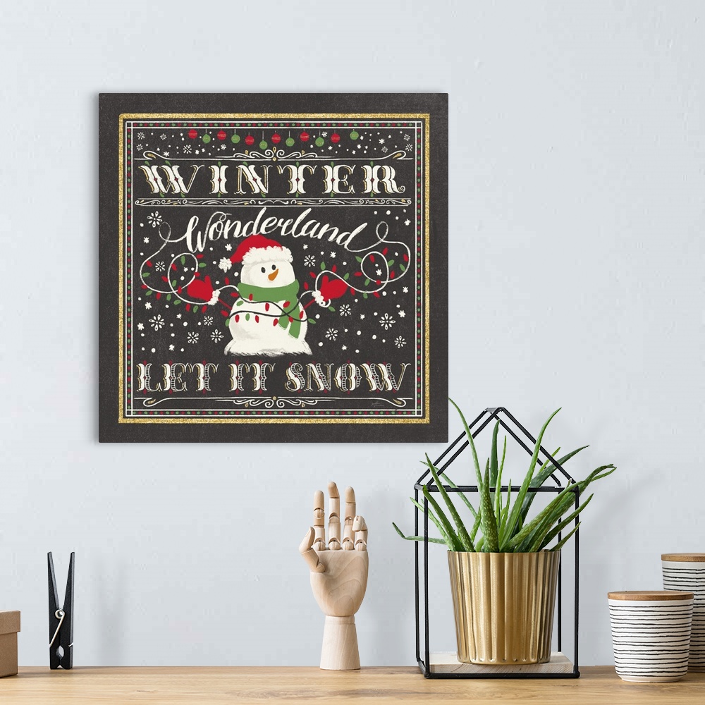 A bohemian room featuring "Winder Wonderland, Let It Snow" with a snowman holding lights on a black backdrop and gold accen...