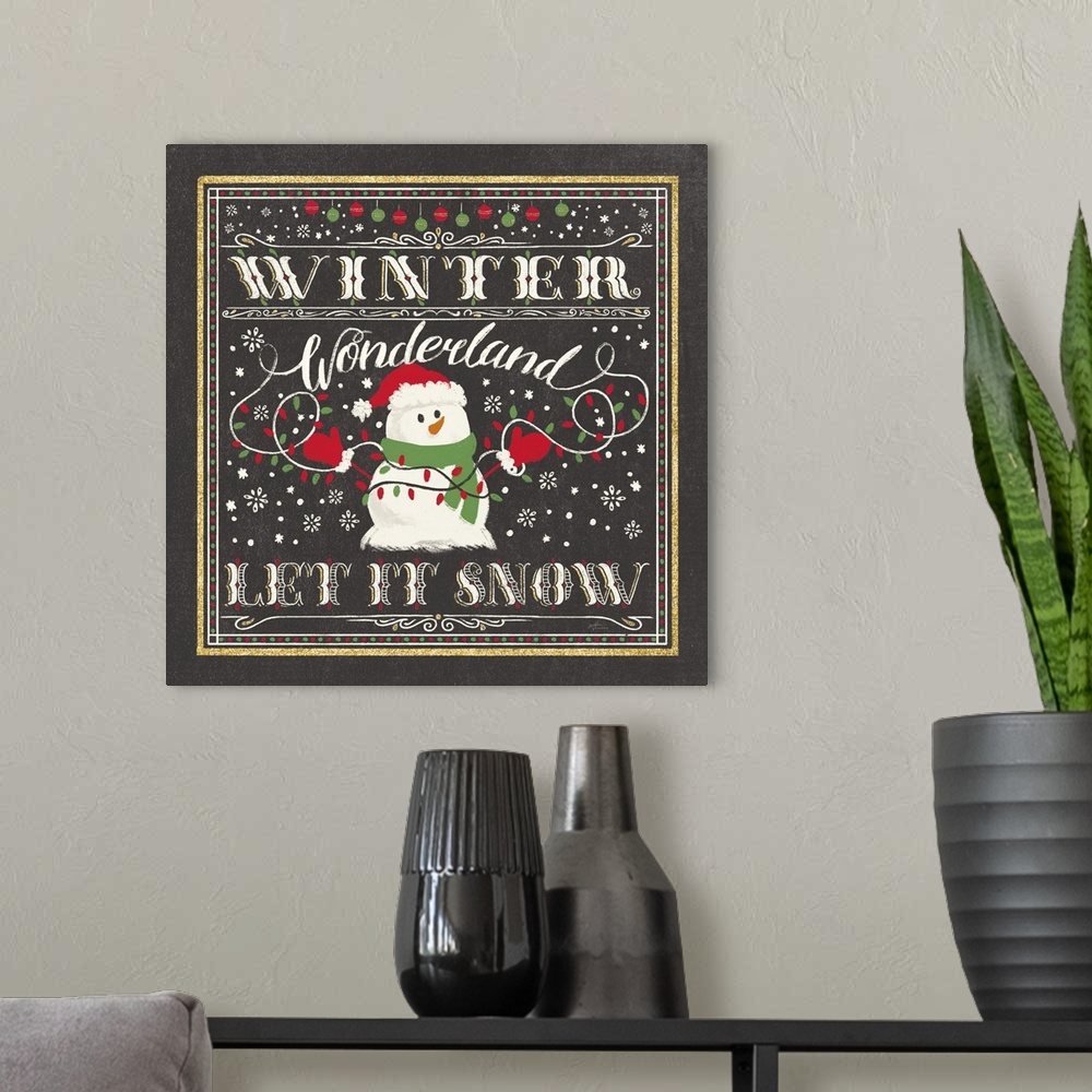 A modern room featuring "Winder Wonderland, Let It Snow" with a snowman holding lights on a black backdrop and gold accen...