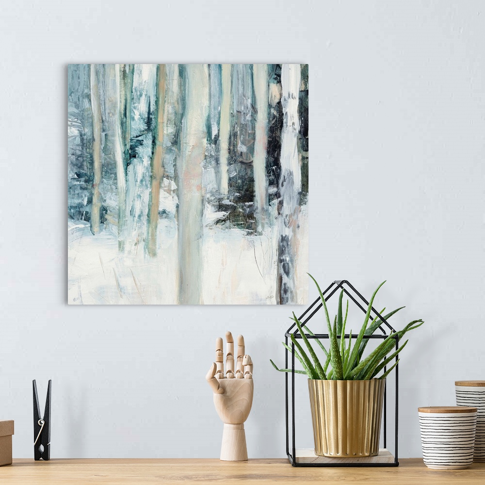 A bohemian room featuring Square abstract painting of birch trees in the woods covered in snow with cool tones.
