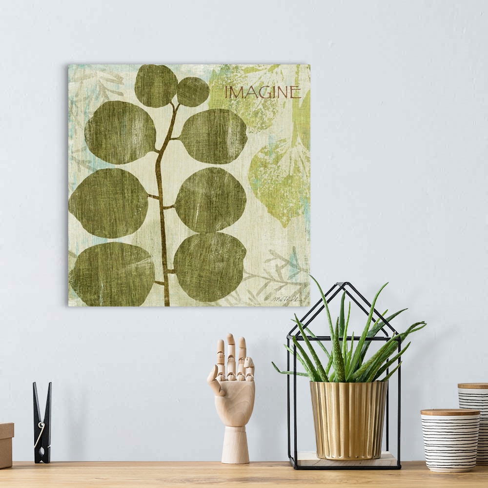 A bohemian room featuring Square painting on canvas of the stenciled print of a plant on top of other faded stencil marks.