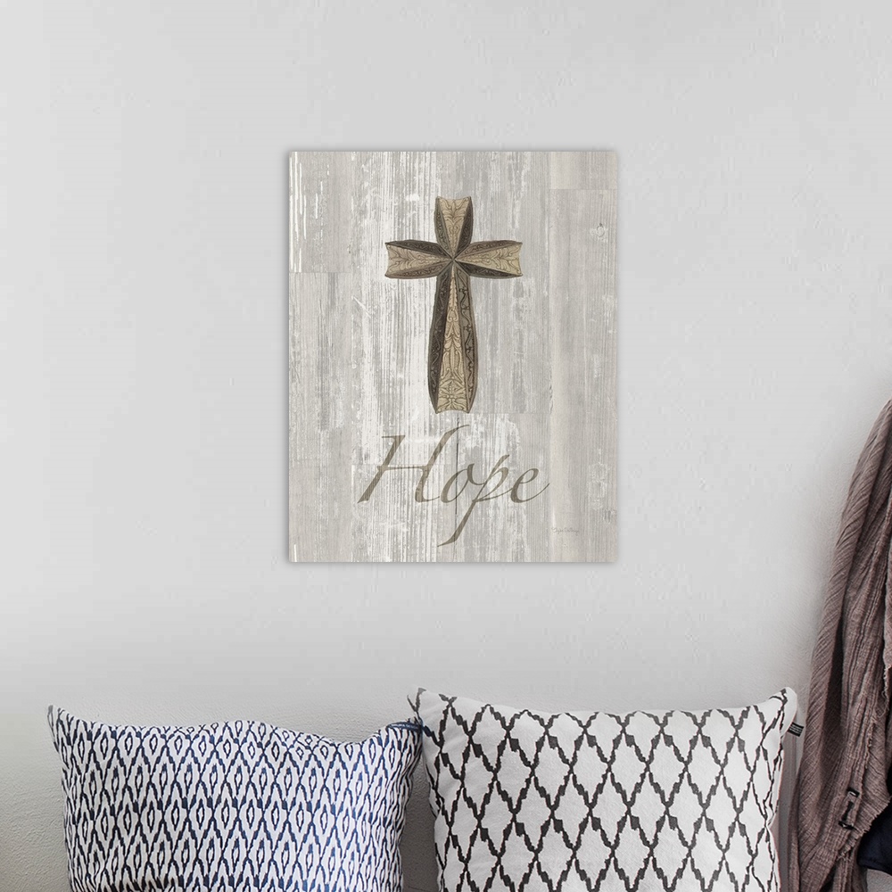 A bohemian room featuring "Hope" with a large cross on a grey wood background.