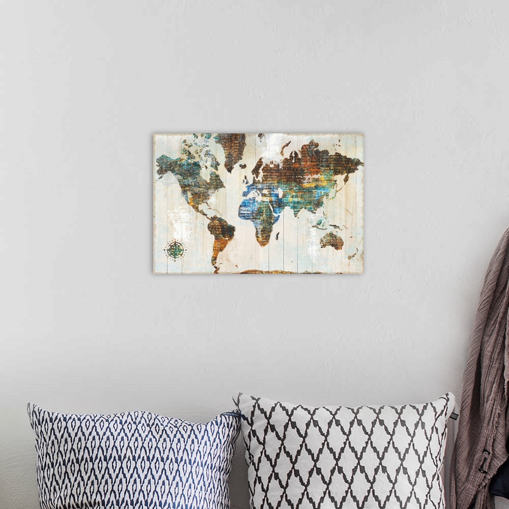 A bohemian room featuring World map made of multi-color textures with text peeping through, on a wood plank backdrop.