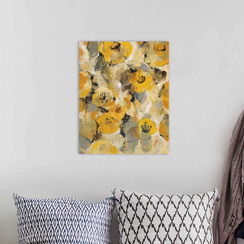 A bohemian room featuring Contemporary painting of several golden flowers.