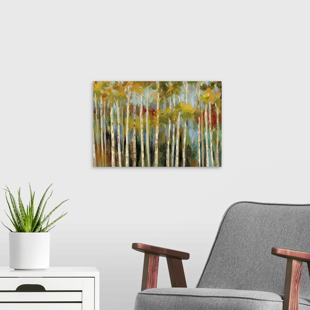 A modern room featuring Contemporary artwork of a forest of thin birch trees in fall colors.