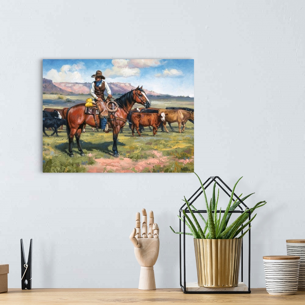 A bohemian room featuring Contemporary Western artwork of a cowboy on his horse and a herd of cows.