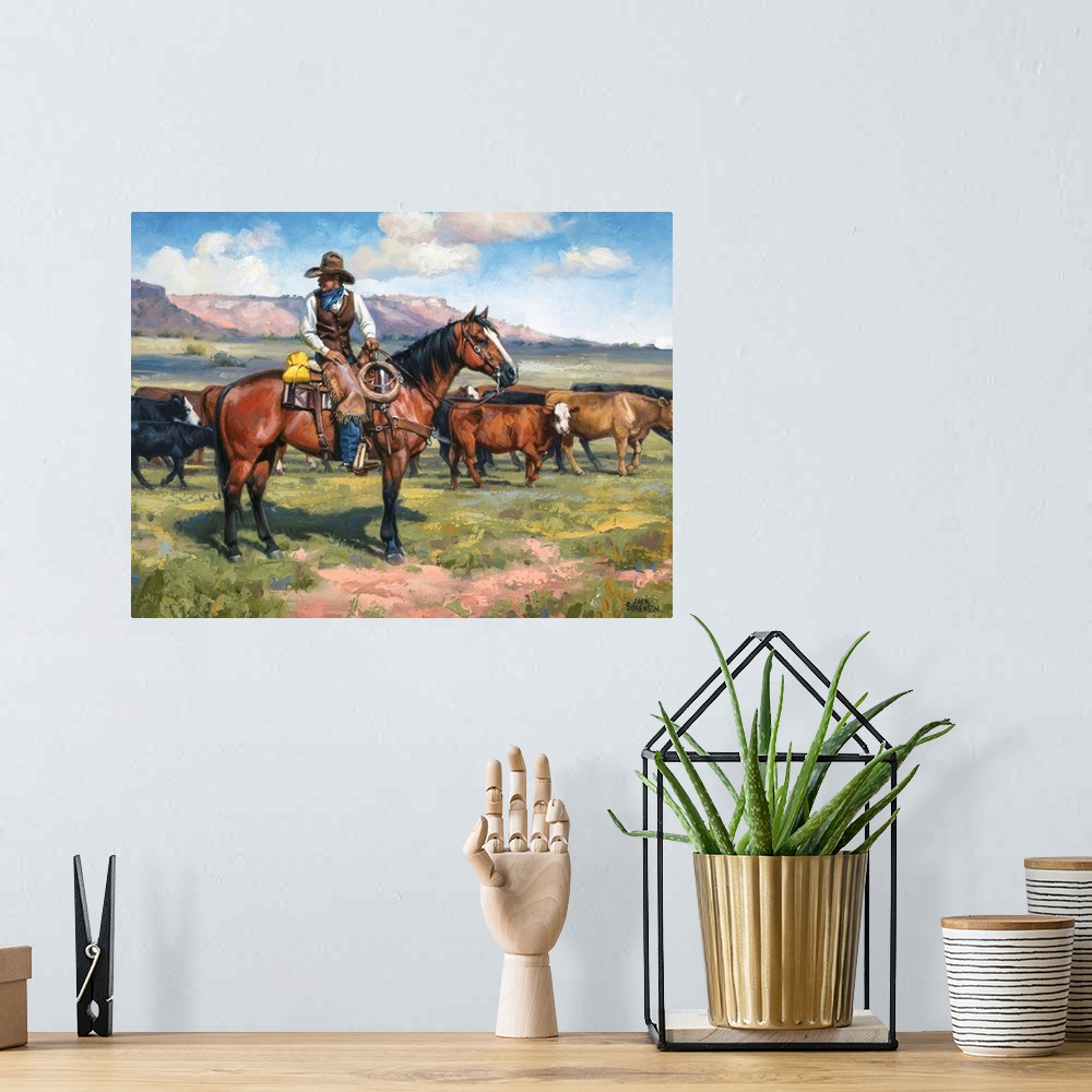 A bohemian room featuring Contemporary Western artwork of a cowboy on his horse and a herd of cows.
