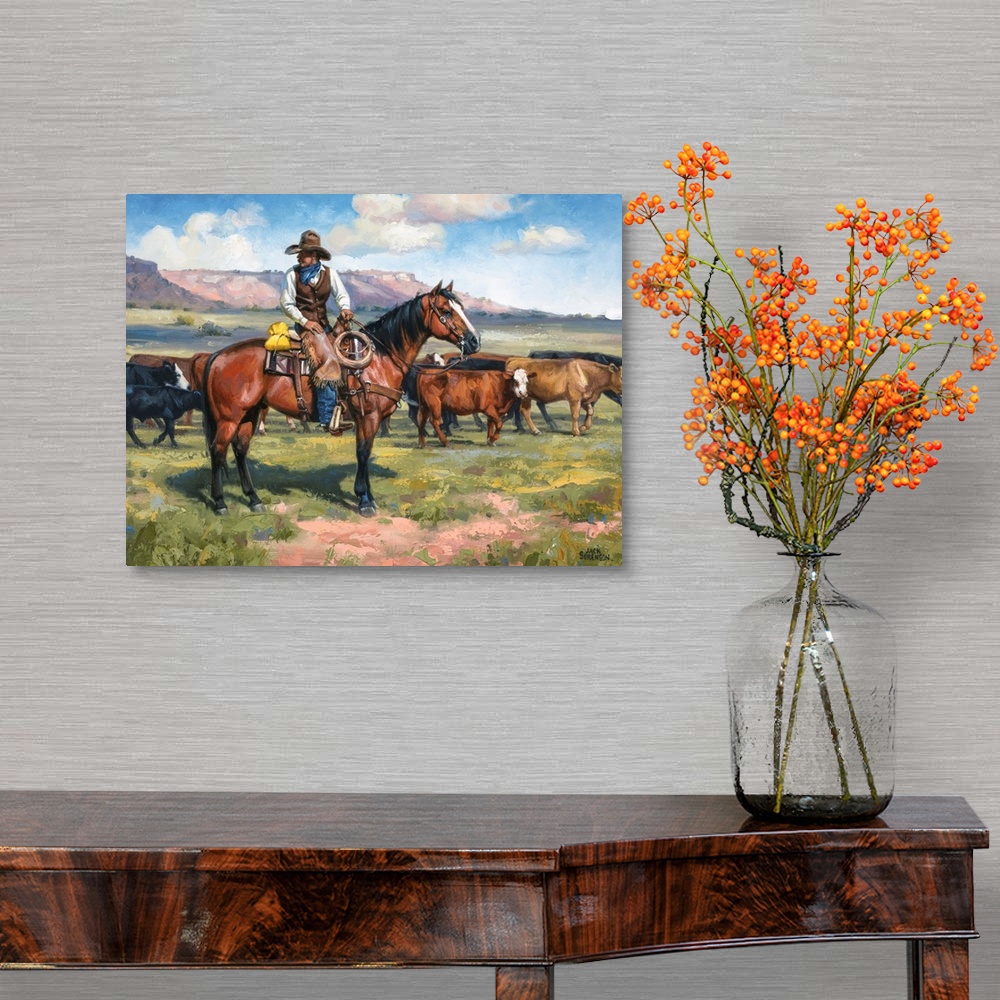 A traditional room featuring Contemporary Western artwork of a cowboy on his horse and a herd of cows.