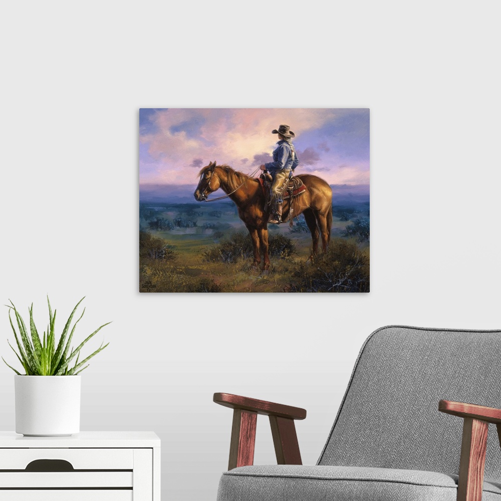 A modern room featuring Contemporary Western artwork of a cowboy on his horse in the glow of the setting sun.