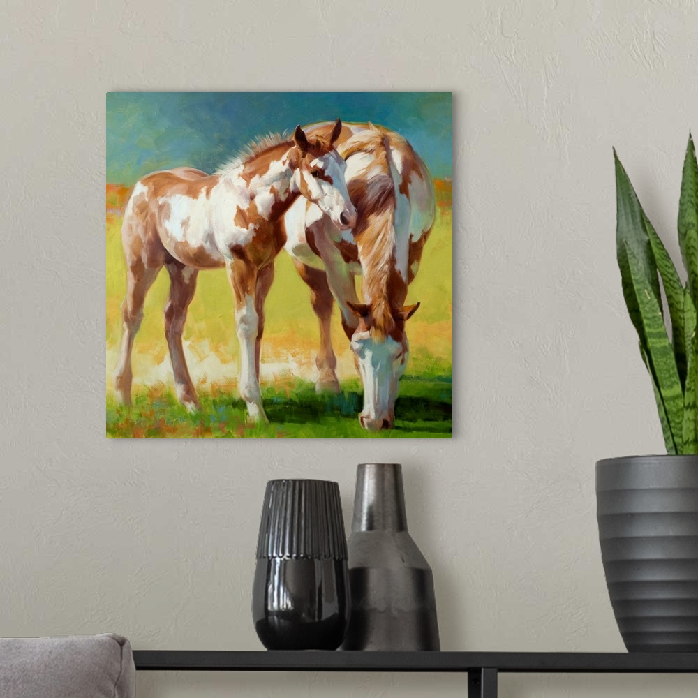 A modern room featuring A Paint mare and her foal grazing in a field in soft light.