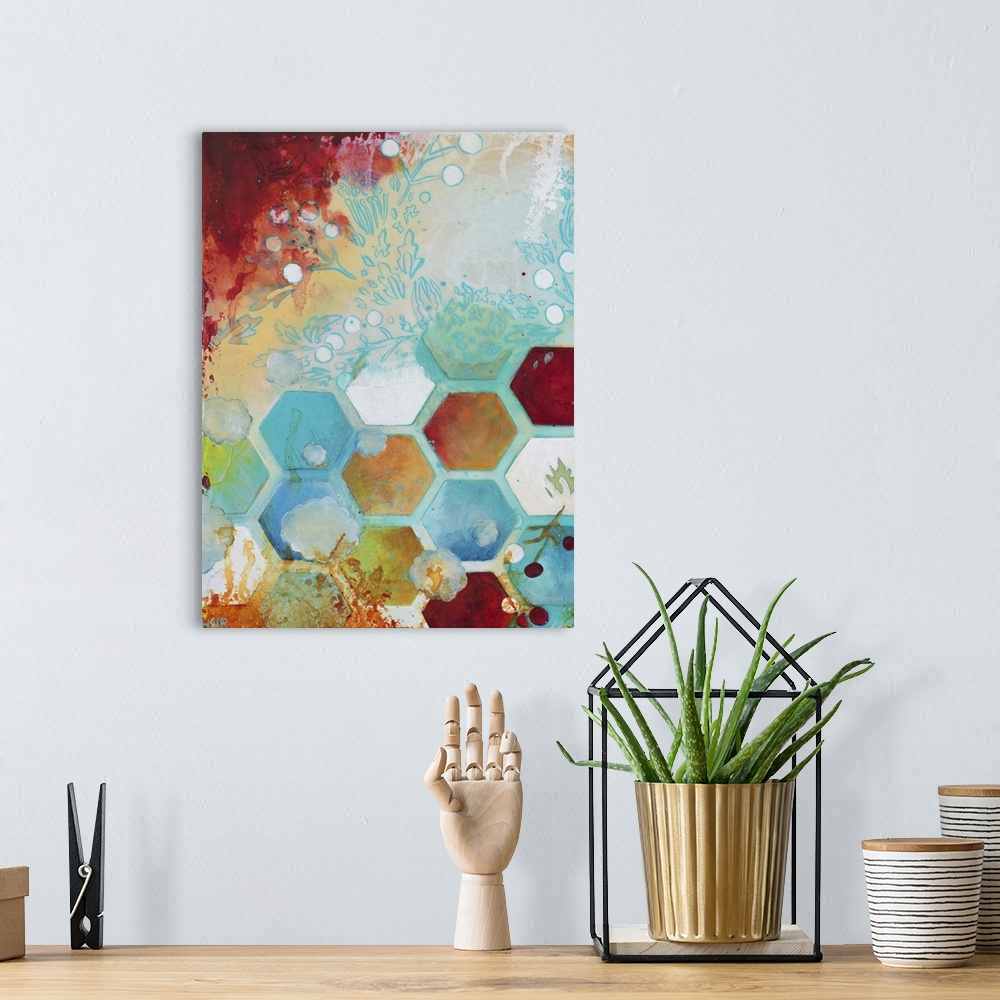 A bohemian room featuring Abstract artwork in shades of turquoise and orange with a geometric hexagon pattern and floral el...